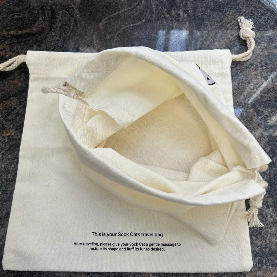 Custom printed cotton travel bag with logo — factory flat-lay photo