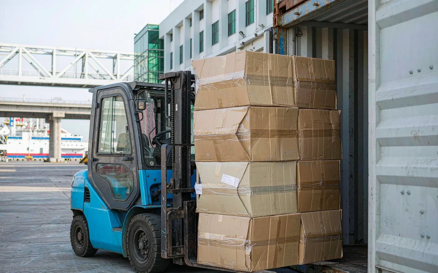 Export cartons being loaded into a shipping container